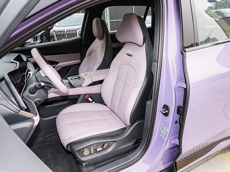 Luxury car interior with lavender leather seats and modern dashboard
