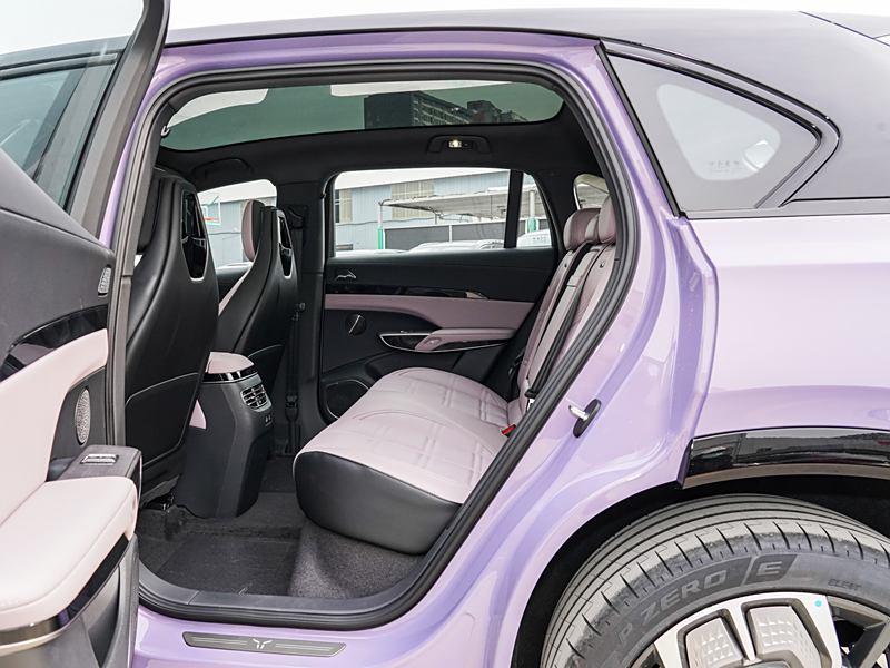 Rear seat view of luxury car with lavender leather interior